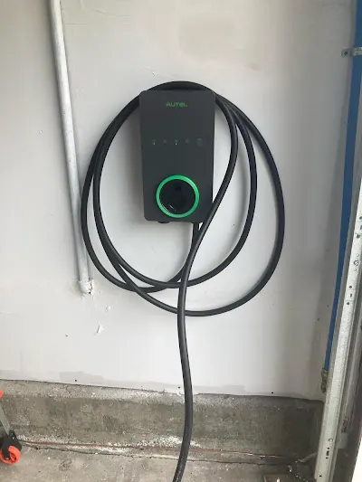 Level 2 EV charger on a garage wall