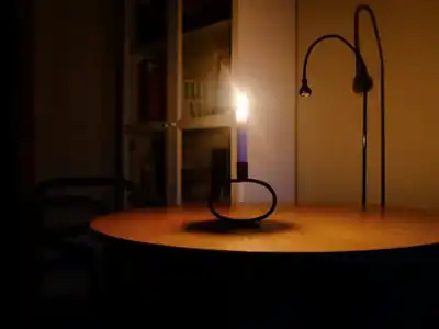 Dark room lit by a candle during a power loss