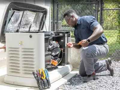 Technician working on a standby generator