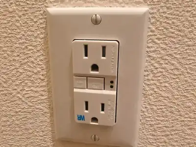 GFCI outlet with test and reset buttons