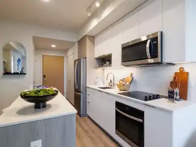 Kitchen with refrigerator and microwave