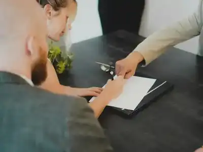Homeowners signing paperwork